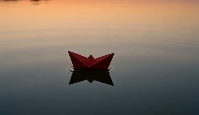 Taomate H3 video example: a red paper boat on a quiet pond at sunrise
